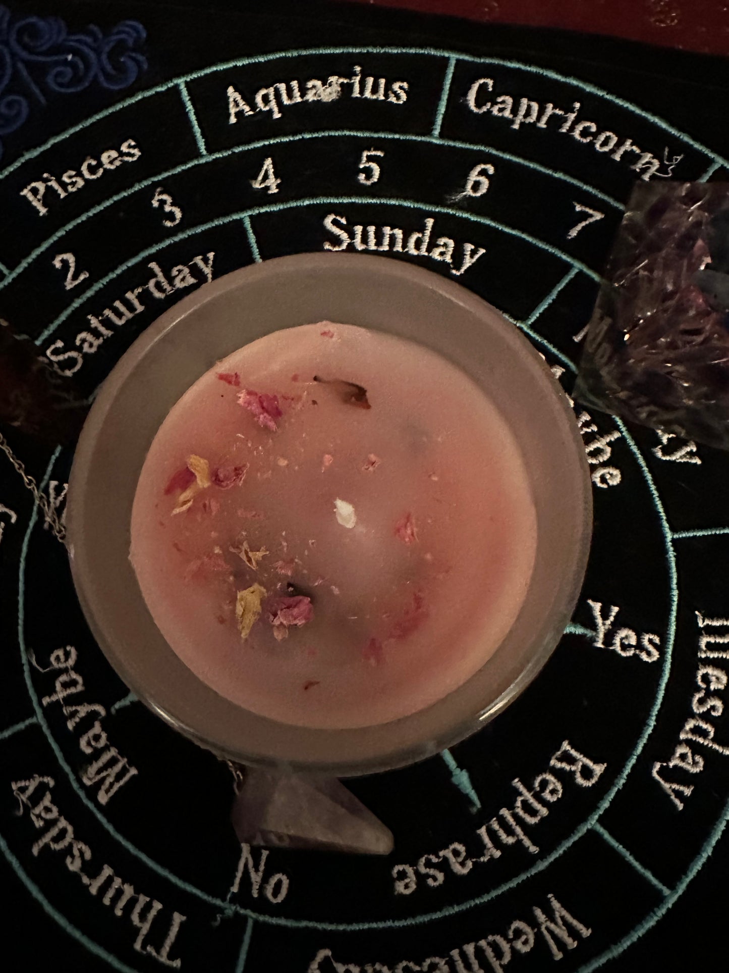Beeswax ritual candles with herbs and crystals